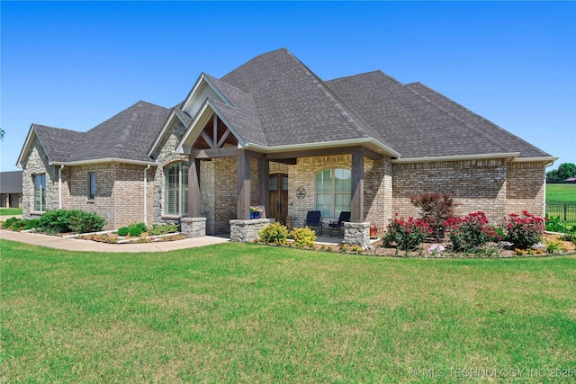 1580 Dawson Dr, Fort Gibson, OK 74434 - view of front of property with brick siding, a front yard, and roof with shingles