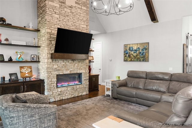 1580 Dawson Dr, Fort Gibson, OK 74434 - living room with a chandelier, a fireplace, wood finished floors, and high vaulted ceiling