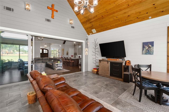 1580 Dawson Dr, Fort Gibson, OK 74434 - living area with a chandelier, high vaulted ceiling, wooden walls, stone finish flooring, and wooden ceiling