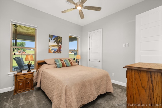 1580 Dawson Dr, Fort Gibson, OK 74434 - bedroom featuring baseboards, dark colored carpet, and a ceiling fan