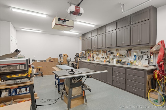 1580 Dawson Dr, Fort Gibson, OK 74434 - garage with a workshop area and a garage door opener