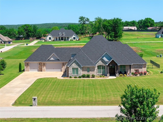 1580 Dawson Dr, Fort Gibson, OK 74434 - view of front of home featuring driveway, a garage, a shingled roof, stone siding, and a front yard