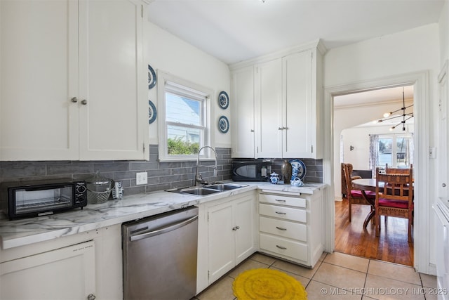 1224 S Columbia Pl, Tulsa, OK 74104 - kitchen featuring dishwasher, a sink, plenty of natural light, and a chandelier