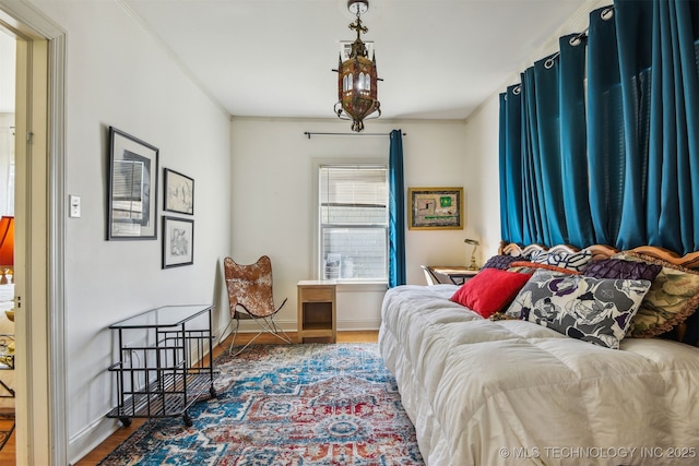 1224 S Columbia Pl, Tulsa, OK 74104 - bedroom featuring wood finished floors and baseboards