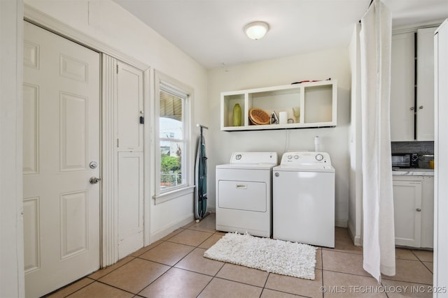 1224 S Columbia Pl, Tulsa, OK 74104 - laundry room with independent washer and dryer, light tile patterned floors, and baseboards
