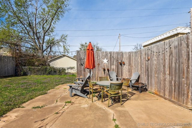 1224 S Columbia Pl, Tulsa, OK 74104 - view of patio featuring a fire pit