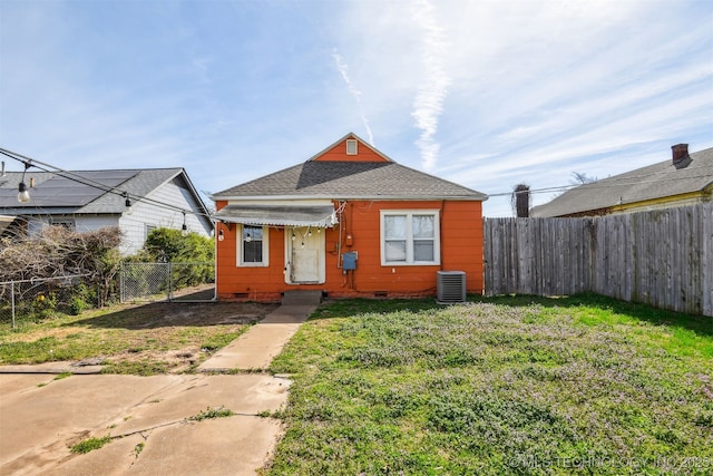 1224 S Columbia Pl, Tulsa, OK 74104 - view of front of home with crawl space, a shingled roof, and cooling unit