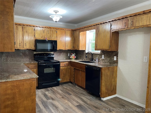 422 N Forest St, Jenks, OK 74037 - kitchen with black appliances, a sink, brown cabinets, tasteful backsplash, and crown molding