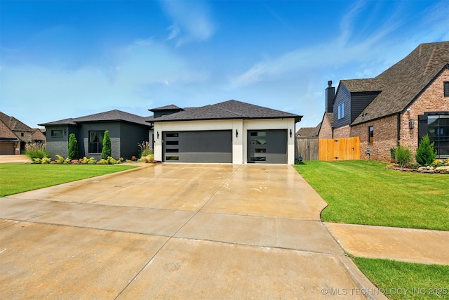 5807 E 128th St S, Bixby, OK 74008 - prairie-style home with a garage, driveway, and stucco siding