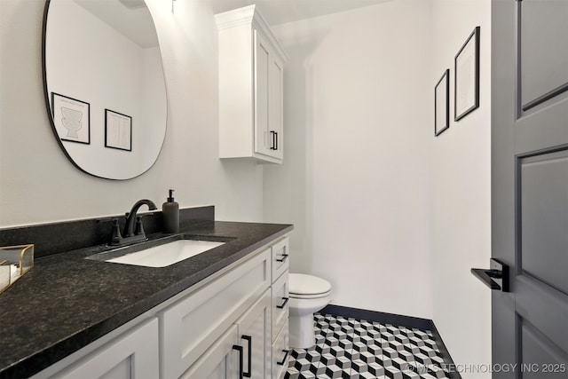 5807 E 128th St S, Bixby, OK 74008 - bathroom featuring vanity, toilet, and baseboards