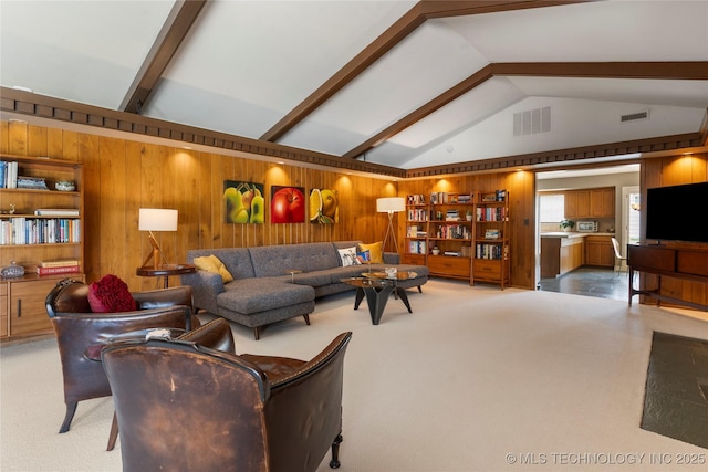 6232 S Jamestown Ave, Tulsa, OK 74136 - living room featuring wood walls and carpet flooring