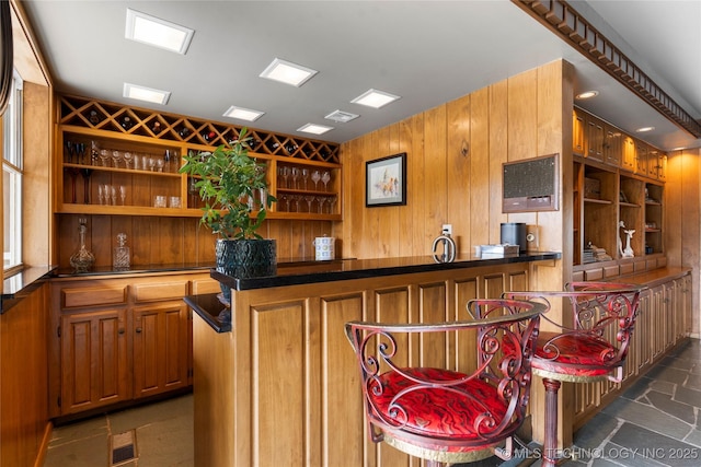 6232 S Jamestown Ave, Tulsa, OK 74136 - indoor bar with wood walls and dark stone finish flooring