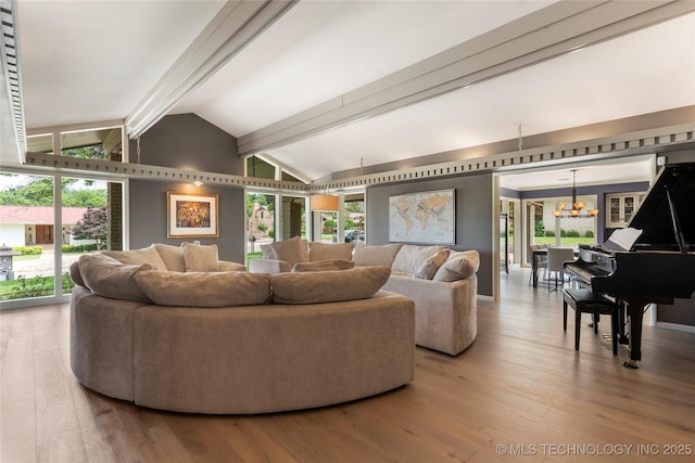 6232 S Jamestown Ave, Tulsa, OK 74136 - living area featuring a chandelier, wood finished floors, and healthy amount of natural light