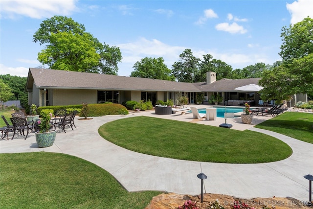 6232 S Jamestown Ave, Tulsa, OK 74136 - outdoor pool with a patio and a lawn