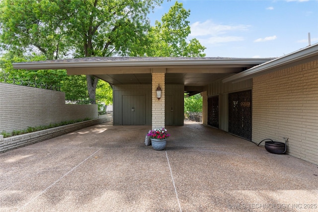 6232 S Jamestown Ave, Tulsa, OK 74136 - view of car parking featuring driveway and a carport