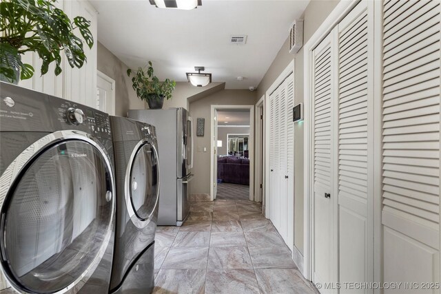 6232 S Jamestown Ave, Tulsa, OK 74136 - laundry room featuring washer and clothes dryer and baseboards