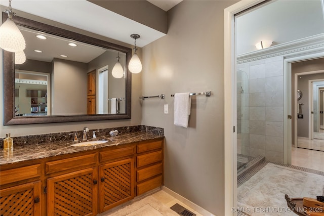 6232 S Jamestown Ave, Tulsa, OK 74136 - bathroom featuring baseboards, a shower stall, vanity, and recessed lighting