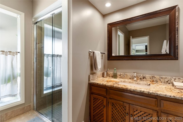 6232 S Jamestown Ave, Tulsa, OK 74136 - full bathroom featuring vanity, a shower stall, and tile patterned floors