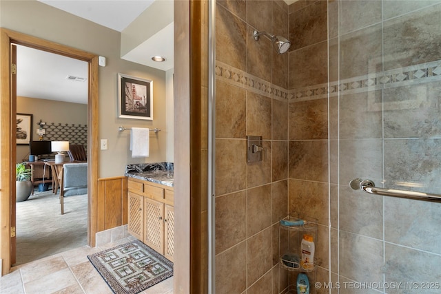 6232 S Jamestown Ave, Tulsa, OK 74136 - full bathroom featuring a shower stall, vanity, and a wainscoted wall