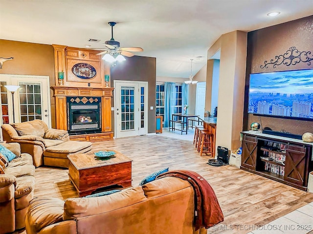 418847 E 1208th Rd, Eufaula, OK 74432 - living area featuring ceiling fan, a large fireplace, wood finished floors, a textured wall, and recessed lighting