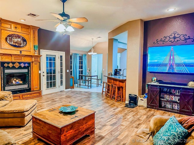 418847 E 1208th Rd, Eufaula, OK 74432 - living area featuring wood finished floors, a ceiling fan, a chandelier, lofted ceiling, and recessed lighting