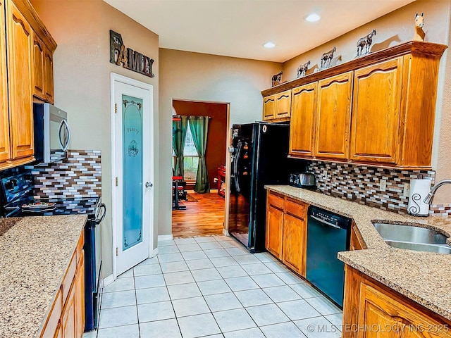 418847 E 1208th Rd, Eufaula, OK 74432 - kitchen featuring black appliances, a sink, light tile patterned floors, decorative backsplash, and recessed lighting