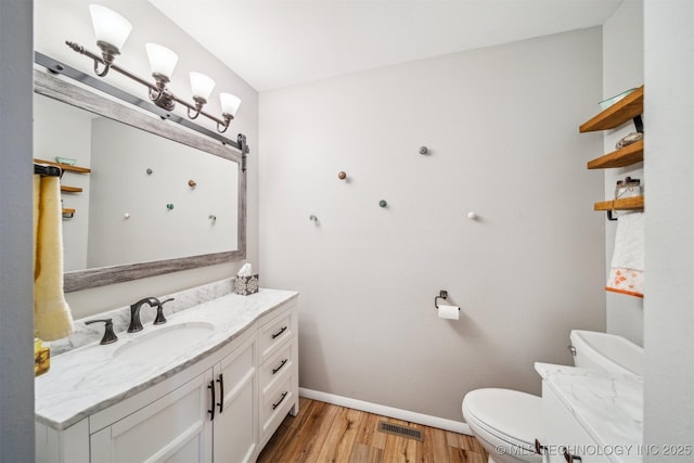 55890 E 315th Rd, Jay, OK 74346 - bathroom featuring vanity, wood finished floors, toilet, and baseboards