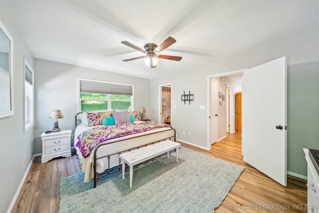 55890 E 315th Rd, Jay, OK 74346 - bedroom with light wood-style flooring, baseboards, and ceiling fan