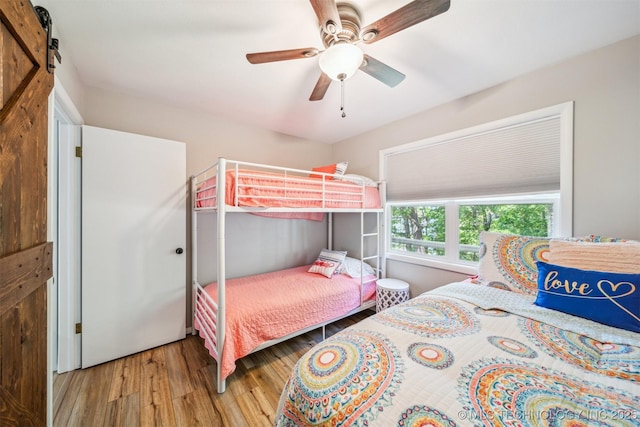 55890 E 315th Rd, Jay, OK 74346 - bedroom with wood finished floors and ceiling fan