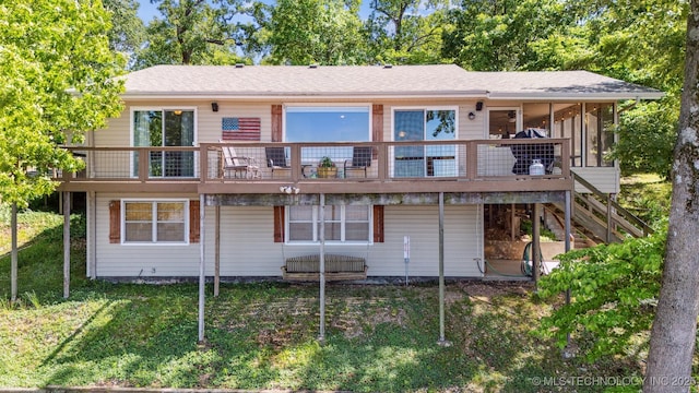 55890 E 315th Rd, Jay, OK 74346 - rear view of house with stairs, a wooden deck, a yard, and a sunroom