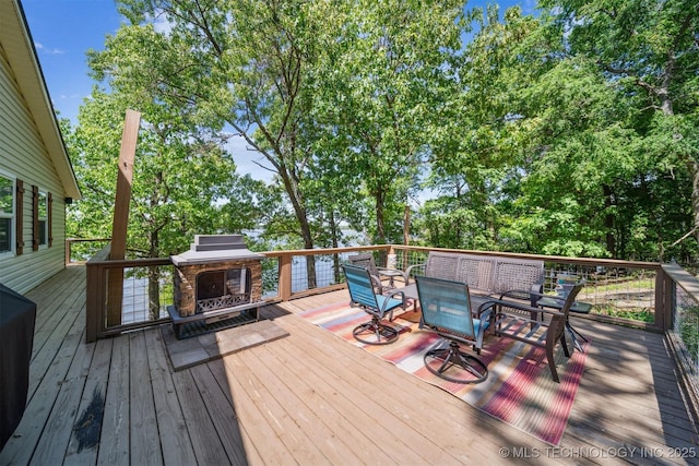 55890 E 315th Rd, Jay, OK 74346 - deck featuring outdoor dining space and view of scattered trees