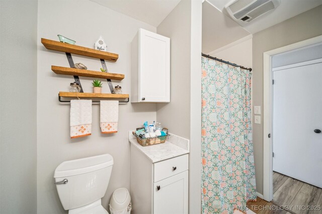 55890 E 315th Rd, Jay, OK 74346 - full bath featuring toilet, wood finished floors, and curtained shower
