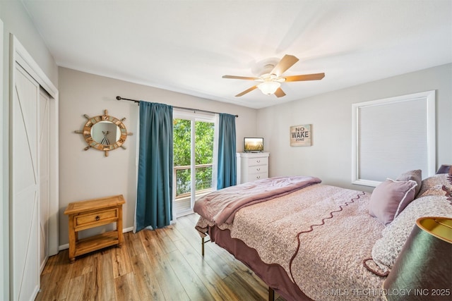55890 E 315th Rd, Jay, OK 74346 - bedroom featuring light wood finished floors, a closet, baseboards, and a ceiling fan