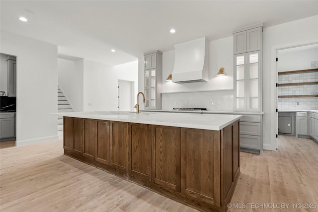 3917 S Madison Ave, Tulsa, OK 74105 - kitchen featuring premium range hood, tasteful backsplash, light wood finished floors, gray cabinets, and recessed lighting