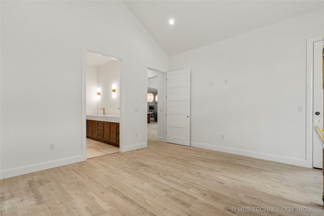 3917 S Madison Ave, Tulsa, OK 74105 - unfurnished bedroom with light wood-type flooring, high vaulted ceiling, ensuite bathroom, baseboards, and recessed lighting