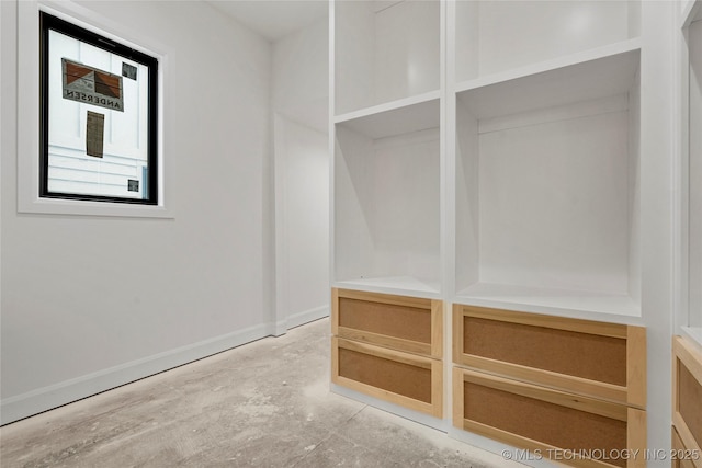 3917 S Madison Ave, Tulsa, OK 74105 - mudroom featuring unfinished concrete floors and baseboards