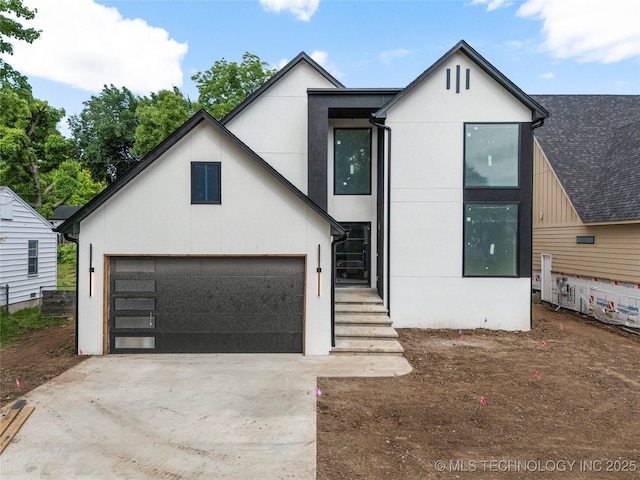 3917 S Madison Ave, Tulsa, OK 74105 - modern home with stucco siding and driveway