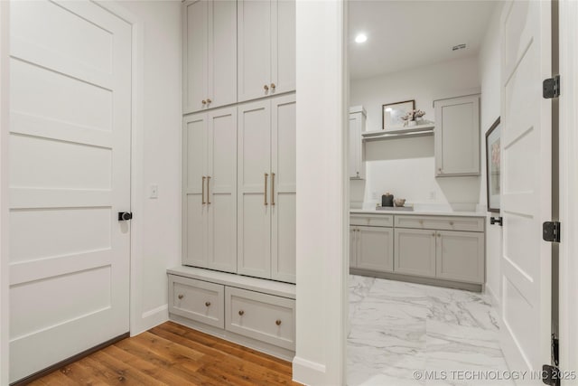 3917 S Madison Ave, Tulsa, OK 74105 - mudroom featuring light marble finish flooring and recessed lighting
