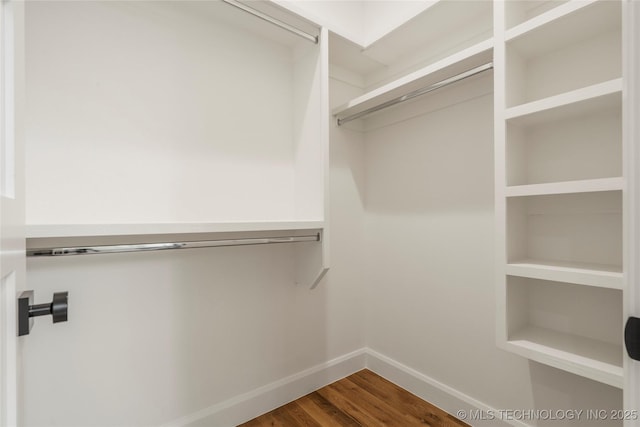 3917 S Madison Ave, Tulsa, OK 74105 - walk in closet with dark wood-style floors