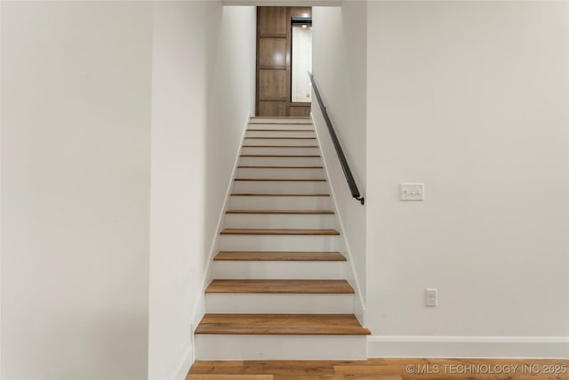 3917 S Madison Ave, Tulsa, OK 74105 - stairs featuring baseboards and wood finished floors