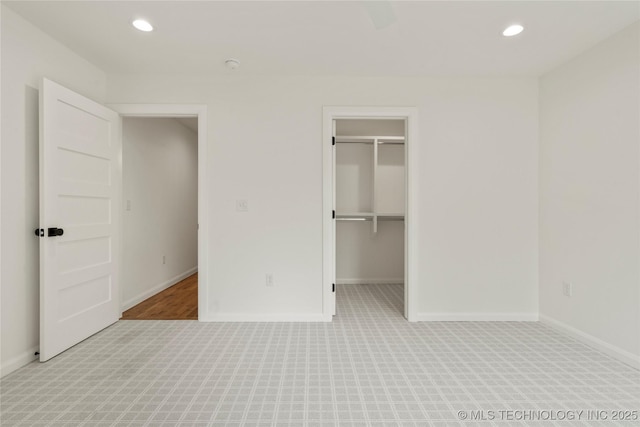 3917 S Madison Ave, Tulsa, OK 74105 - unfurnished bedroom featuring recessed lighting, a walk in closet, and carpet flooring