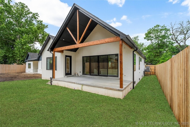 3917 S Madison Ave, Tulsa, OK 74105 - rear view of house with stucco siding, a patio, and a fenced backyard
