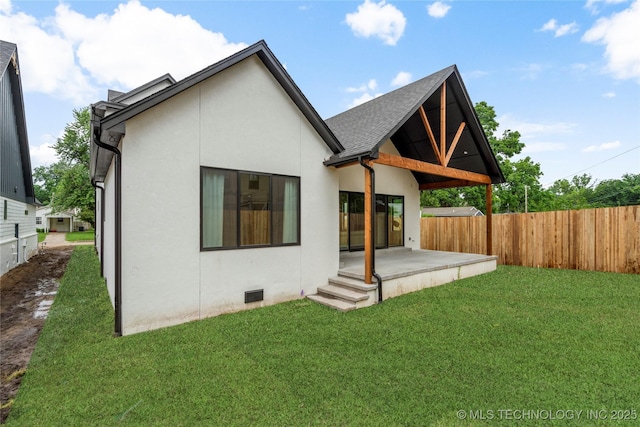 3917 S Madison Ave, Tulsa, OK 74105 - back of house with a patio area, stucco siding, and roof with shingles