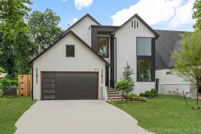 3917 S Madison Ave, Tulsa, OK 74105 - contemporary home featuring driveway, a front lawn, a garage, and stucco siding