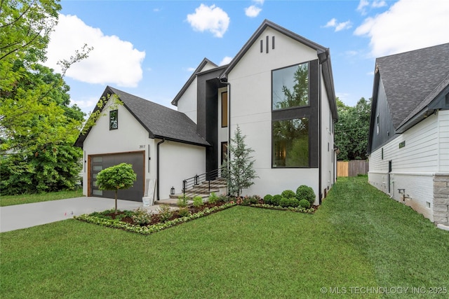3917 S Madison Ave, Tulsa, OK 74105 - view of front of home with stucco siding, concrete driveway, a garage, and a front lawn