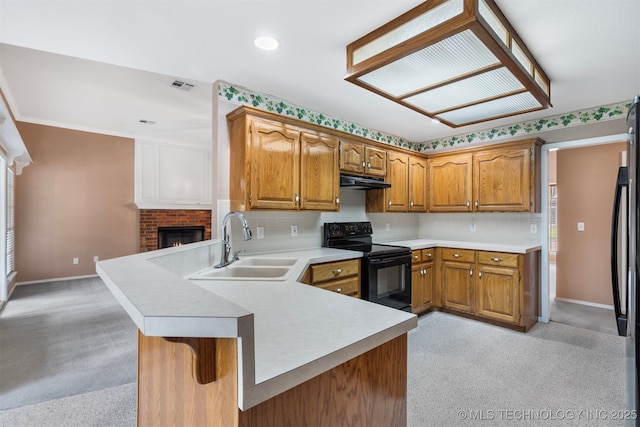 1940 Timberton Rd, Sapulpa, OK 74066 - kitchen with black / electric stove, a sink, a peninsula, light countertops, and baseboards