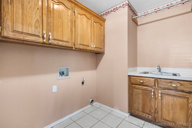 1940 Timberton Rd, Sapulpa, OK 74066 - washroom featuring cabinet space, hookup for a washing machine, electric dryer hookup, light tile patterned floors, and baseboards