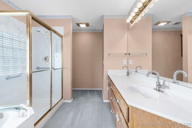 1940 Timberton Rd, Sapulpa, OK 74066 - bathroom with double vanity, baseboards, a stall shower, and a bath