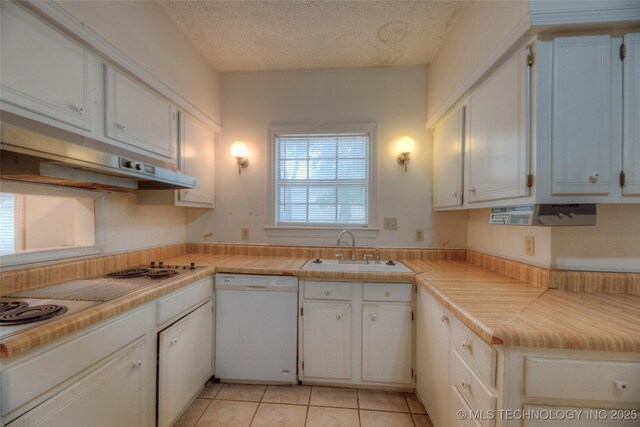 234 E Freeport St, Broken Arrow, OK 74012 - kitchen featuring dishwasher, a sink, white cabinetry, light countertops, and a textured ceiling