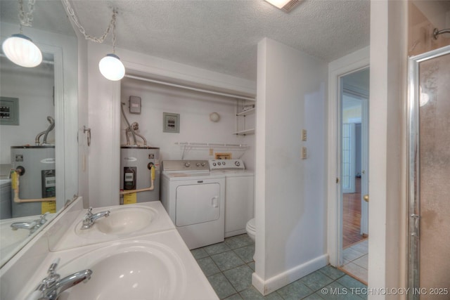 234 E Freeport St, Broken Arrow, OK 74012 - bathroom with electric water heater, tile patterned flooring, water heater, double vanity, and a textured ceiling
